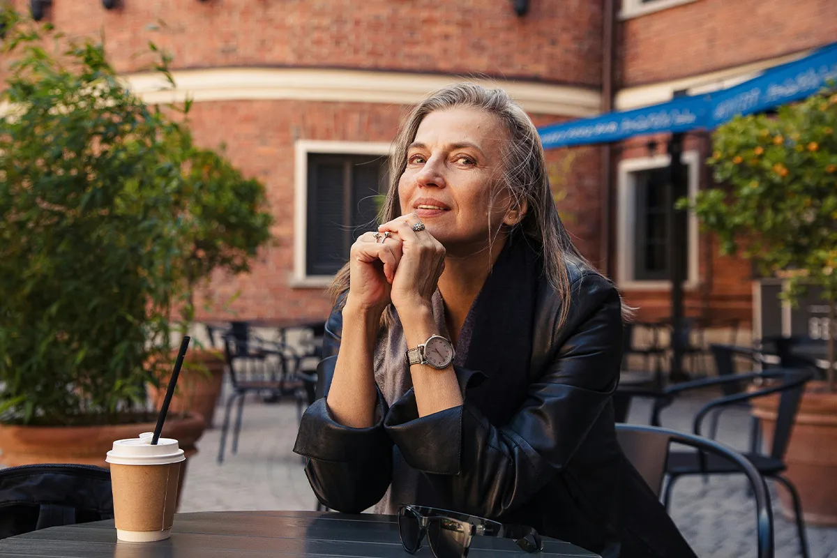 A middle-aged woman drinking coffee