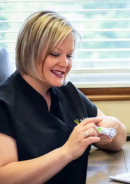 A nurse practitioner holding weight loss medication